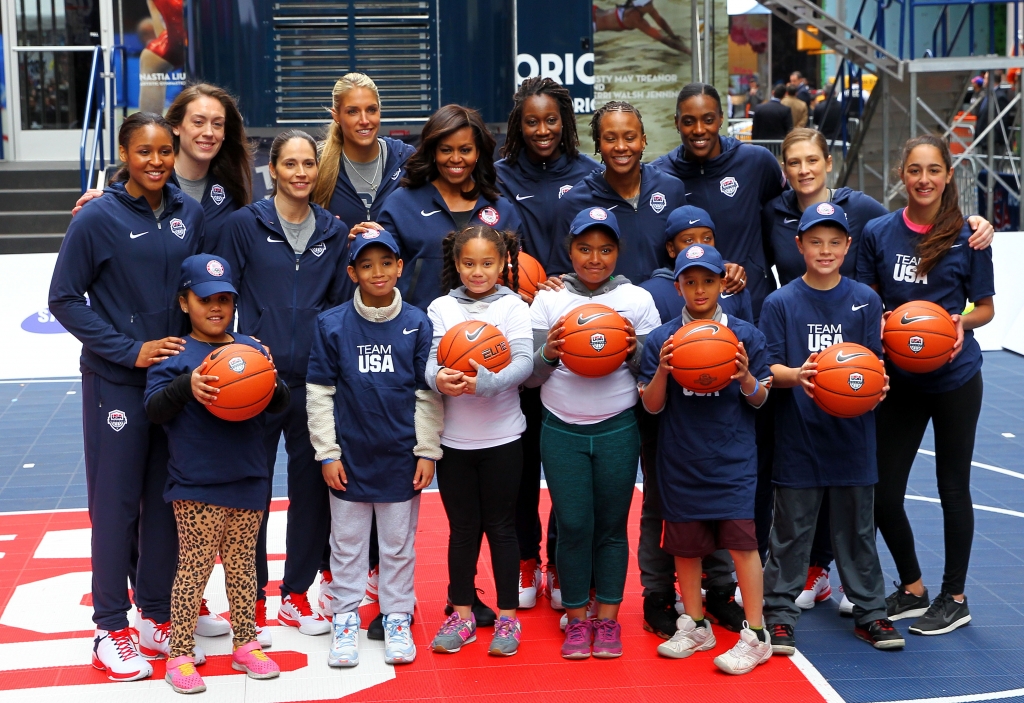 First lady of the United States Michelle Obama poses with the women's basketball team during Team USA's Road to Rio Tour presented by Liberty Mutual on Thursday in New York City. The event marks 100 days until the Opening Ceremony of the Rio 201