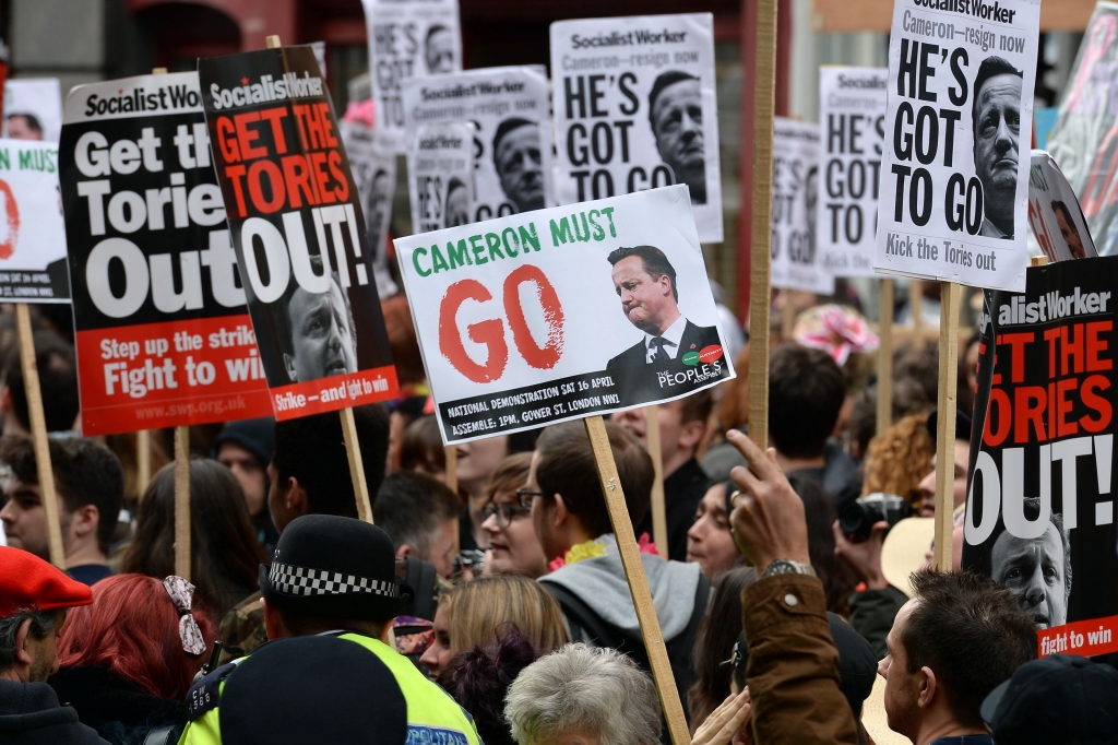 Protesters call for the resignation of Prime Minister David Cameron outside the Conservative party's spring forum in central London on Saturday