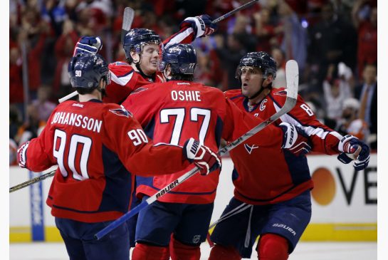 The Capitals celebrate a second-period goal by defenceman John Carlson in Thursday's opener of their playoff series against Philly