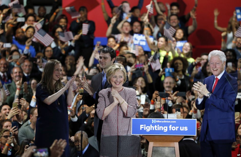 Democratic presidential candidate Hillary Clinton center celebrates on stage with her family from left Chelsea Clinton Mark Mezvinsky and husband former president Bill Clinton right at her victory party after winning the New York state primary