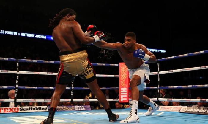 Anthony Joshua KOs Charles Martin in two rounds to win IBF world heavyweight title