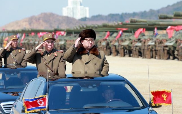 North Korean leader Kim Jong Un salutes as he arrives to inspect a military drill at an unknown location in this undated