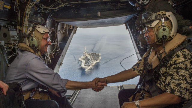 Secretary of Defense Ash Carter and Philippine Secretary of National Defense Voltaire Gazmin shake hands on a Marine Corps V-22 Osprey as they depart the the aircraft carrier USS John C. Stennis. U.S. Air Force