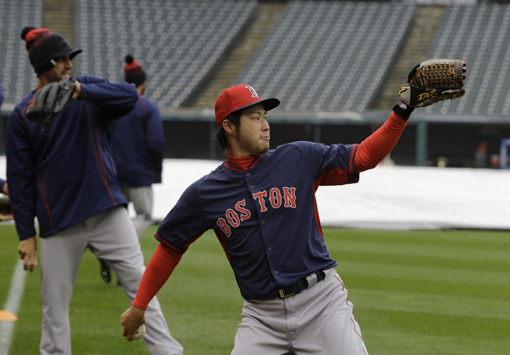 Boston Red Sox relief pitcher Junichi Tazawa warms up before a baseball game between the Red Sox and the Cleveland Indians Monday