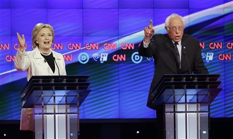 Democratic presidential candidates Sen. Bernie Sanders I-Vt. right and Hillary Clinton speak during the CNN Democratic Presidential Primary Debate at the Brooklyn Navy Yard on Thursday