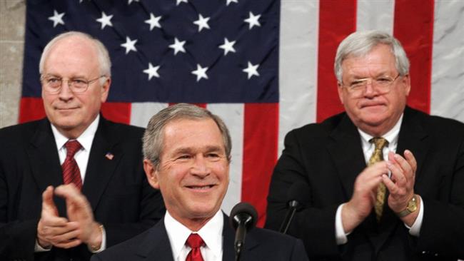 President George W. Bush center is applauded by Vice President Dick Cheney left and speaker of the House Dennis Hastert right during Bush's State of the Union address at the Congress in Washington DC