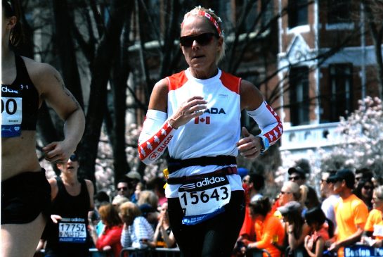 Jill Neufeld running in the 2014 Boston Marathon taken just as the finish line came into her view