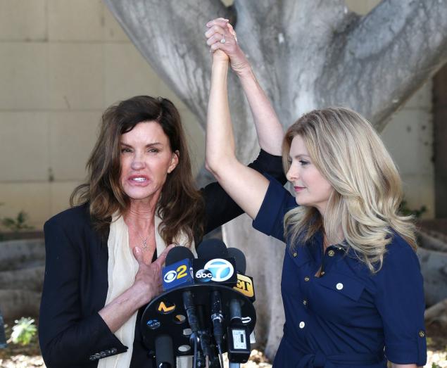 Janice Dickinson celebrates with her attorney Lisa Bloom after a judge ruled her defamation lawsuit against Bill Cosby can move forward