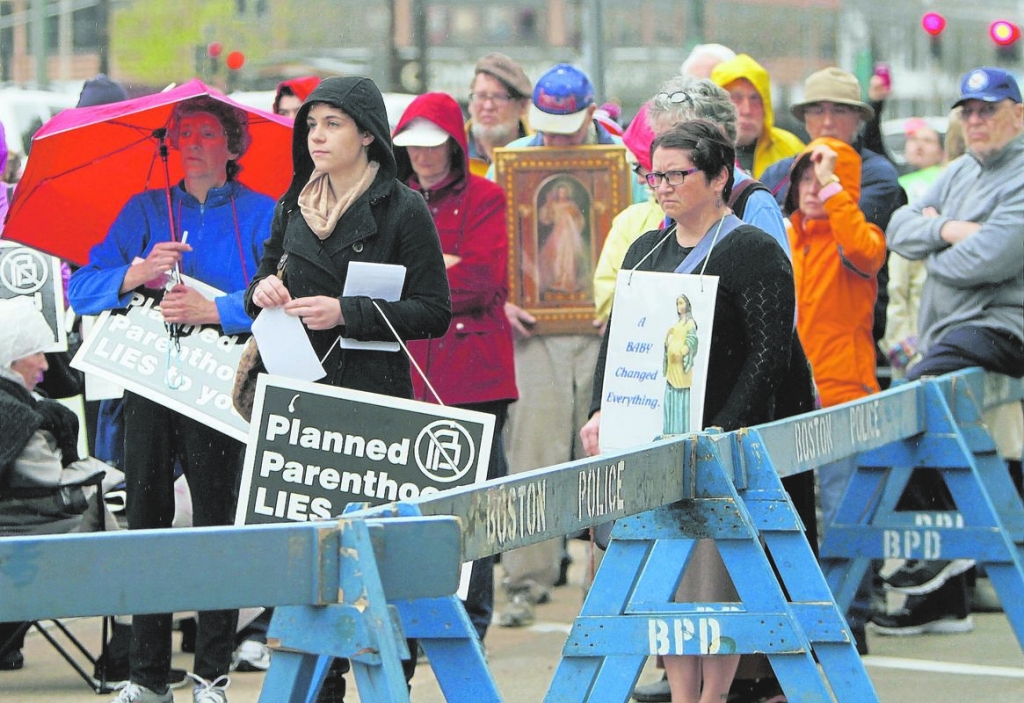 Credit Chitose Suzuki        ‘JUSTICE FOR THE UNBORN’ Pro-life activists demonstrate yesterday outside Planned Parenthood’s Commonwealth Avenue clinic