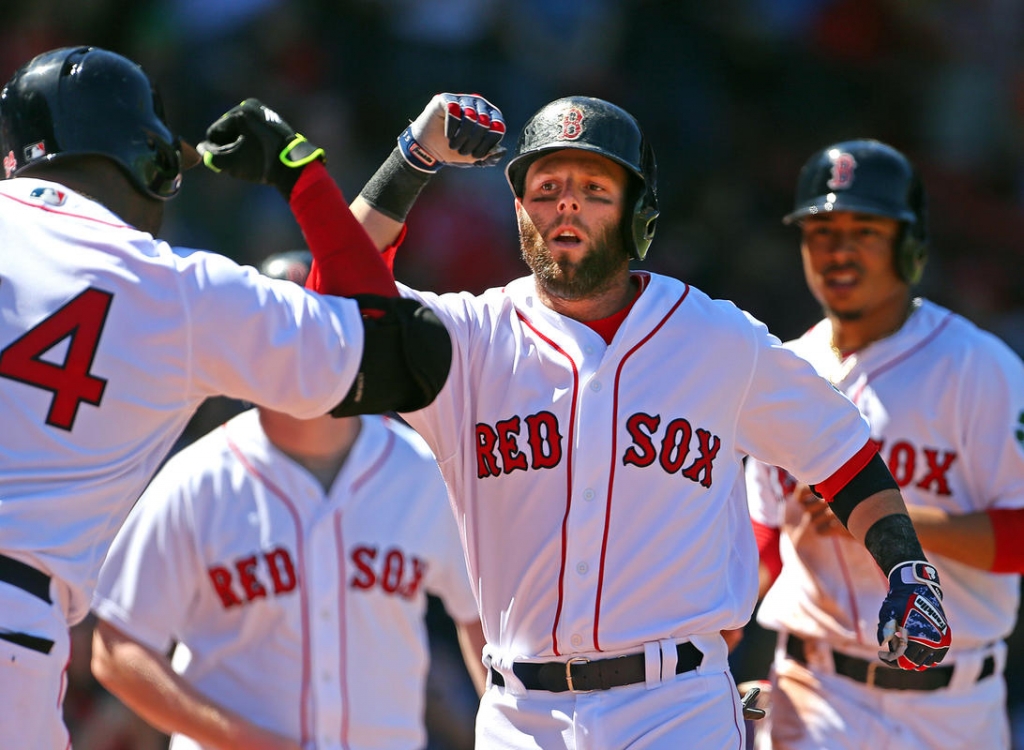 Credit Nancy Lane      Boston Red Sox second baseman Dustin Pedroia celebrates with David Ortiz his RBI home run in the 1st inning