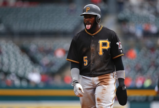 Pittsburgh Pirates Josh Harrison sticks his tongue out walking back to first base after a foul ball against the Detroit Tigers in the second inning of a baseball game Monday