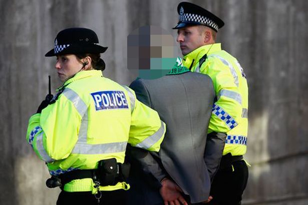 Police restrain a man ahead of Celtic v Rangers Scottish Communities League Cup Football Hampden Park