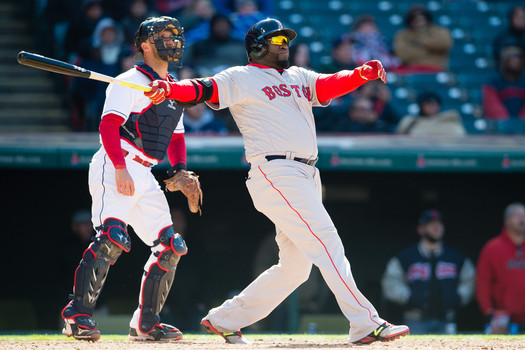 Catcher Yan Gomes #10 of the Cleveland Indians watches as David Ortiz #34 of the Boston Red Sox hits a two-run home run during the ninth inning of the opening day game at Progressive Field