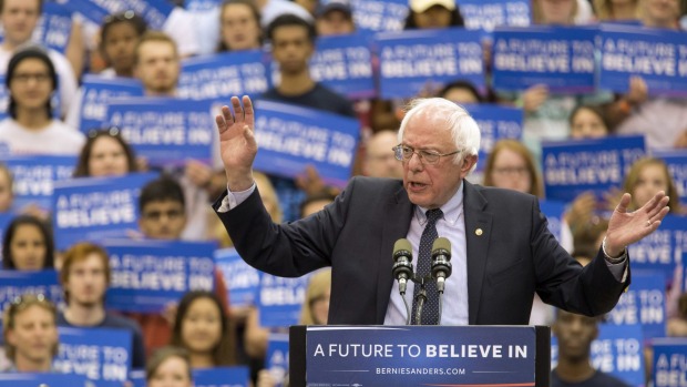 Democratic presidential candidates Secretary Hillary Clinton and Sen. Bernie Sanders appear on stage during the debate