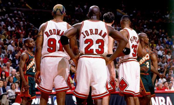 Dennis Rodman Michael Jordan and Scottie Pippen discuss strategy during Game 6 of the 1996 NBA Finals