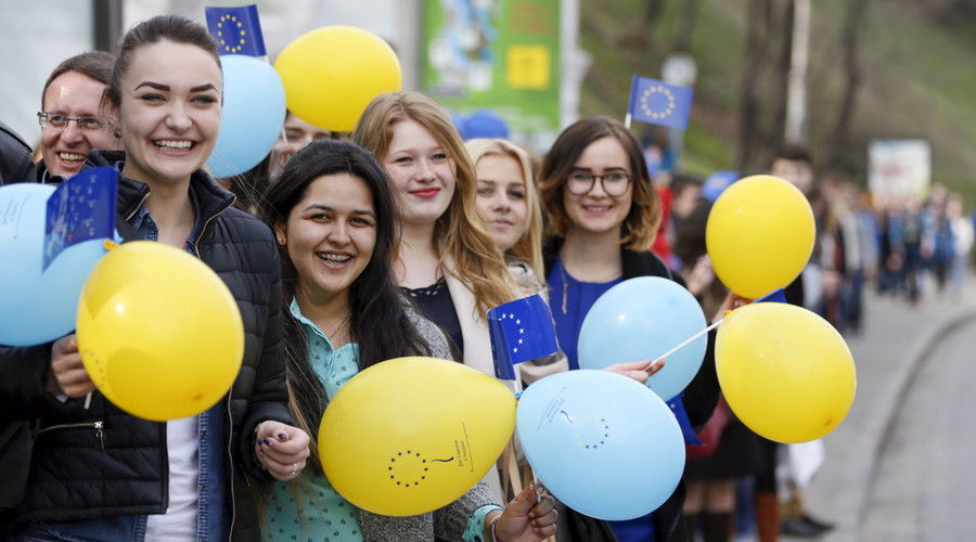 Students attend a flash mob to support a European treaty deepening ties with Ukraine on the eve of a referendum held in the Netherlands