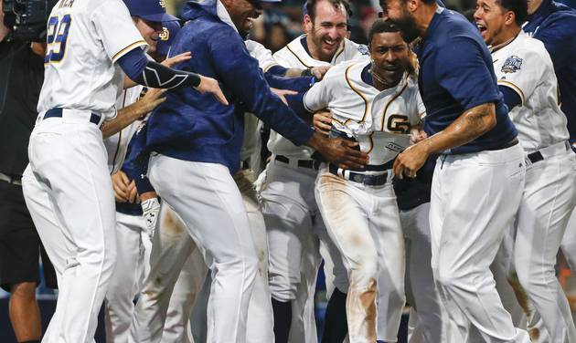 San Diego Padres&#039 Melvin Upton Jr. is mobbed by teammates as they celebrate his two run-homer in the 14th inning that gave the Padres a 5-3 victory over the Arizona Diamondbacks in a baseball game Saturday