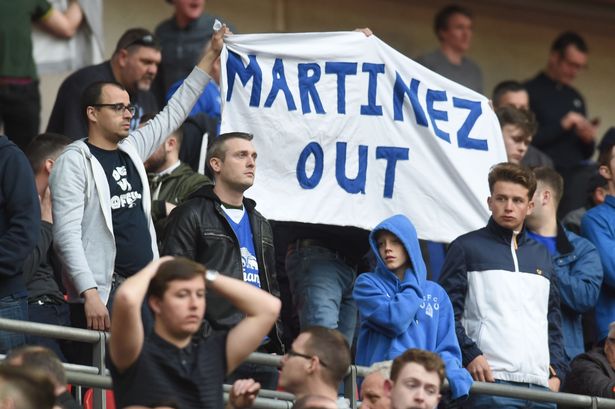 Everton fans with a Martinez out banner at the final whistle