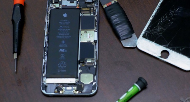 Pieces of an iPhone are seen in a repair store in New York