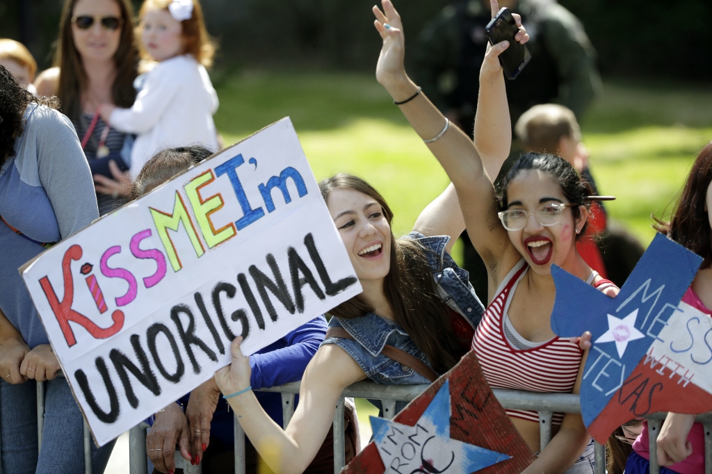 Fans cheer as runners pass Wellesley College during the 120th Boston Marathon on Monday