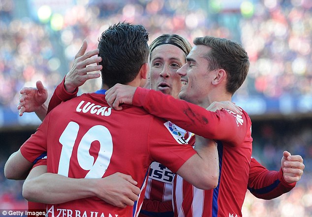 Fernando Torres celebrates with his teammates after the opening goal in the 3-0 win over Granada