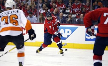 Washington Capitals left wing Alex Ovechkin, from Russia shoots the puck during the second period of Game 1 in the first round of the NHL Stanley Cup hockey playoffs against the Philadelphia Flyers Thursday