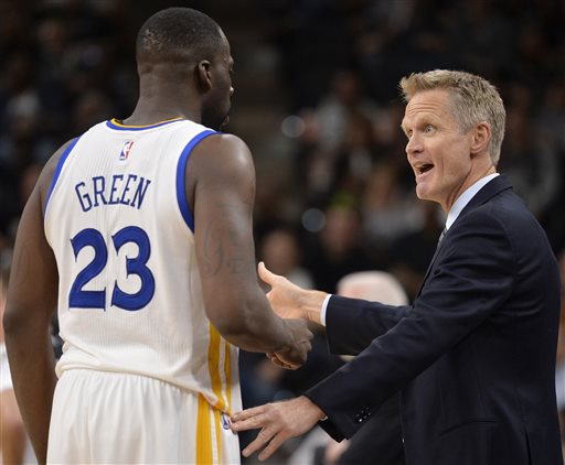 Golden State Warriors head coach Steve Kerr right talks to Golden State forward Draymond Green during the second half of an NBA basketball game against the San Antonio Spurs Sunday