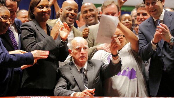 Governor Jerry Brown after signing the new minimum wage law