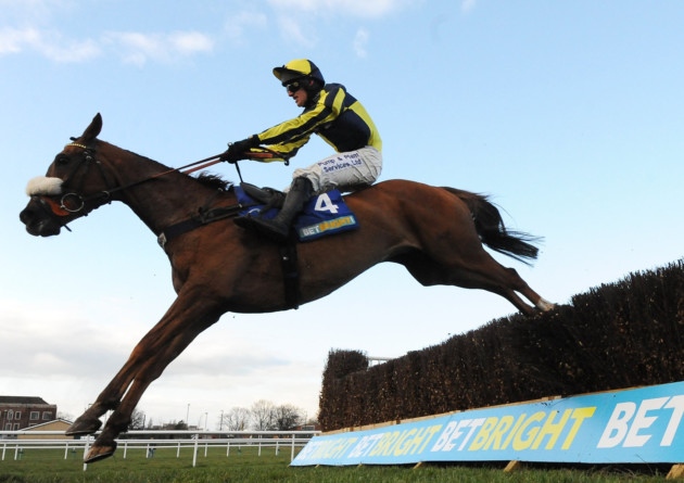 The Last Samuri ridden by David Bass clear the final fence on their way to winning The Bet Bright Grimthorpe Chase at Doncaster Racecourse