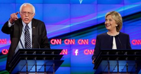 Image Text
 ACCUSATIONS Hillary Clinton with rival candidate Bernie Sanders during Tuesday's Democratic presidential debate