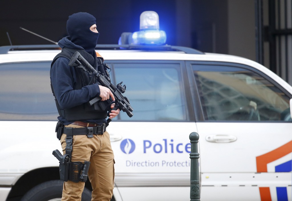 A Belgian special forces police officer stands guard outside a courthouse as Paris attacks suspect Salah Abdelslam remains in police custody in Brussels Belgium