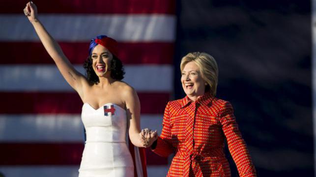 Democratic presidential candidate Hillary Clinton arrives with singer Katy Perry during a campaign rally in Des Moines Iowa 24 October 2015. – Reuters file