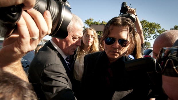 Getty. Fairfax. Amber Heard with her husbane actor Johnny Depp work their way through a media scrum