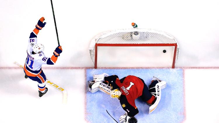 New York Islanders center John Tavares scores a goal past Florida Panthers goalie Roberto Luongo as center Aleksander Barkov looks on in the second period in first round of the 2016 Stanley Cup Playoffs at BB&T Center. The Islanders won 5-4