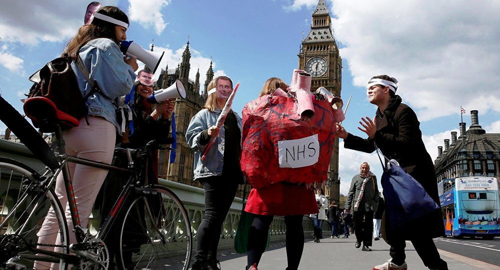 Junior doctors take part in a strike near St Thomas Hospital in London Britain