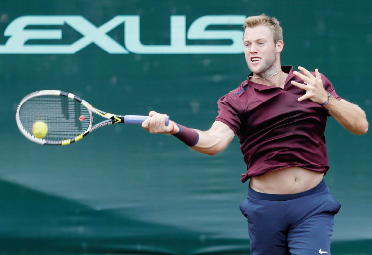 Jack Sock returns a shot against John Isner in the semifinals of the US Men’s Clay Court Championship in Houston Saturday. — AP