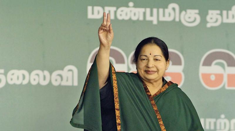 AIADMK supremo J. Jayalalithaa waves to her enthusiastic party cadres during the election campaign at Island grounds on Saturday