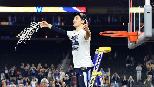 Ryan Arcidiacono cutting down the net