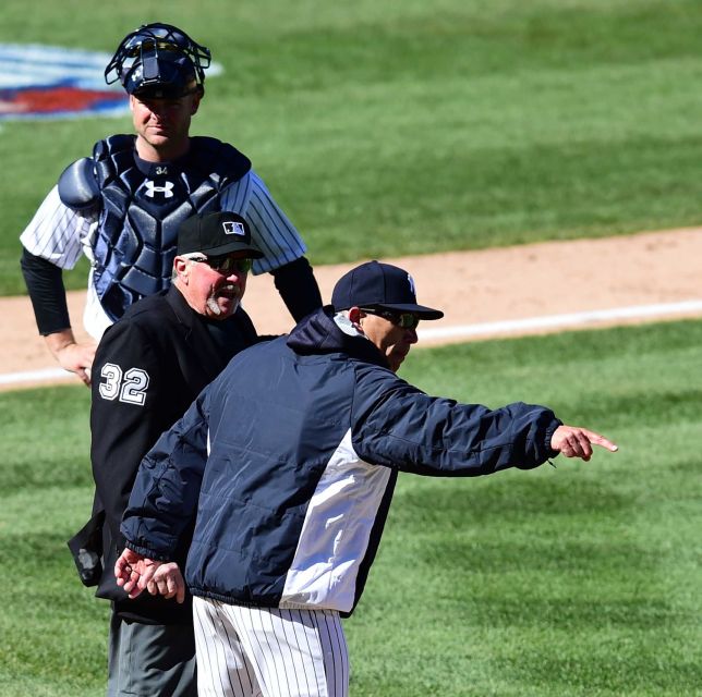 Joe Girardi argues with umpire on the play in 8th inning as the Yankees played under protest lose 5-3