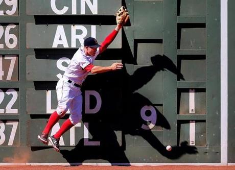 Boston-4/21/16 Red Sox vs Tampa Bay Rays Sox Brock Holt can't catch a long fly off the scoreboard hit for a double by Tampa's Desmond Jennings in the 4th inning. Boston Globe staff