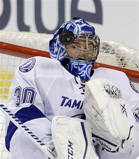 Tampa Bay Lightning goalie Ben Bishop blocks a shot by Florida Panthers center Brandon Pirri in the second period during an NHL preseason hockey game Saturday Oct. 3 2015 in Sunrise Fla