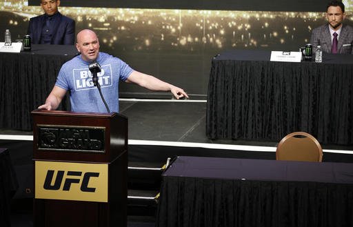 UFC president Dana White speaks beside an empty chair where Conor Mc Gregor was supposed to sit during a news conference for UFC 200 Friday