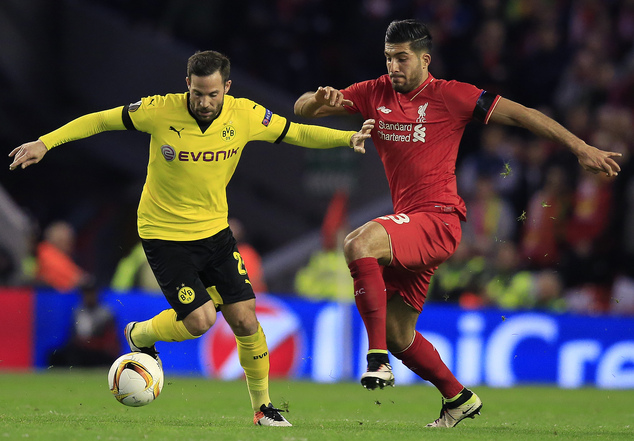 Dortmund's Gonzalo Castro left and Liverpool's Emre Can challenge for the ball during the Europa League quarterfinal second leg soccer match between Liverp