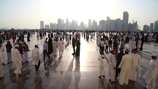 Muslims leave after they perform Eid el Fitr prayer at Imam Muhammad ibn Abd al Wahhab Mosque in Doha Qatar