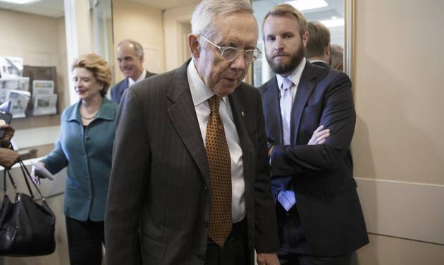 Senate Minority Leader Harry Reid of Nev. followed by Sen. Debbie Stabenow D-Mich. and Sen. Robert Casey D-Pa. arrive for a news conference on Capitol Hill in Washington Thursday