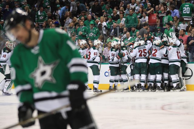 DALLAS TX- APRIL 22 The Minnesota Wild celebrate their win against the Dallas Stars in overtime in Game Five of the Western Conference First Round during the 2016 NHL Stanley Cup Playoffs at American Airlines Center