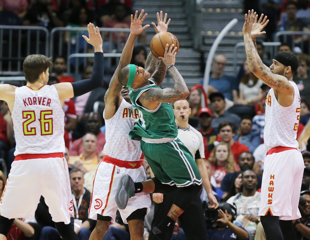 041916 ATLANTA Hawks Kyle Korver, jeff Teague and Mike Scott triple team Celtics Isaiah Thomas stopping his drive to the basket in their NBA Eastern Conference first round playoff game at Philips Arena on Tuesday