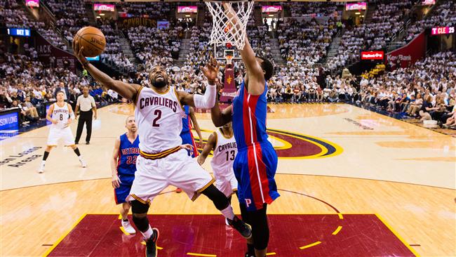 Kyrie Irving #2 of the Cleveland Cavaliers shoots over Andre Drummond #0 of the Detroit Pistons