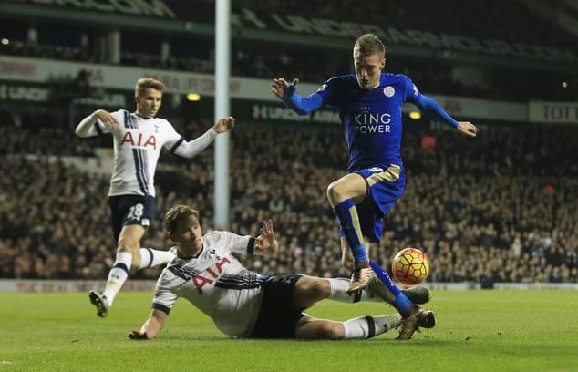 Leicester Citys Jamie Vardy leaps over the tackle of Tottenham Hotspurs Jan Vertonghen during their English Premier League soccer match between Tottenham Hotspur and Leicester City at the White Hart Lane stadium in London Wednesday Jan. 13 2016. (AP