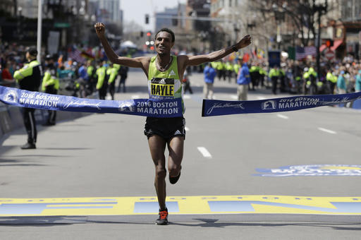 Lemi Berhanu Hayle of Ethiopia breaks the tape to win the 120th Boston Marathon on Monday